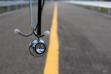 The,Stethoscope,With,The,Asphalt,Background,As,The,Conceptual,Image