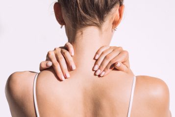 Closeup,Shot,Of,Woman,From,Back,Having,Neck,Or,Shoulder