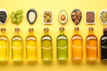 Vegetable,Fats.,Different,Oils,In,Glass,Bottles,And,Ingredients,On