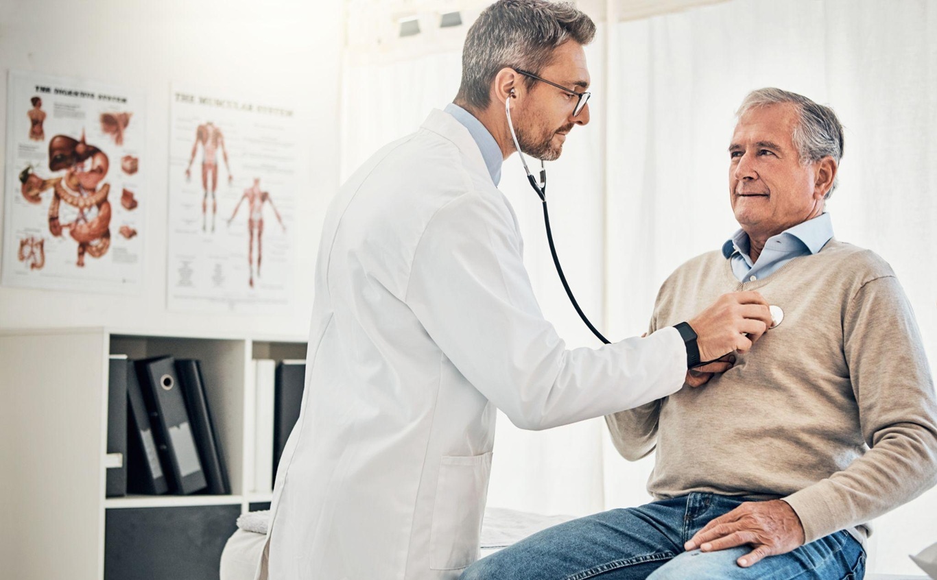 doctor checking patient heartbeat