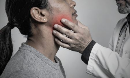 doctor inspecting patient jaw