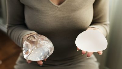 women holding breast implants