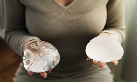 women holding breast implants