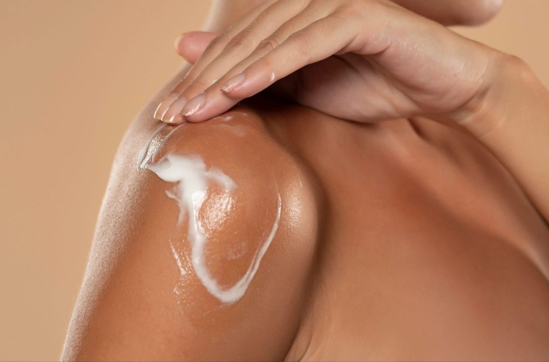 model applying cream on skin