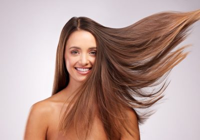 wind and portrait of woman with smile, hairstyle shine and luxury salon treatment