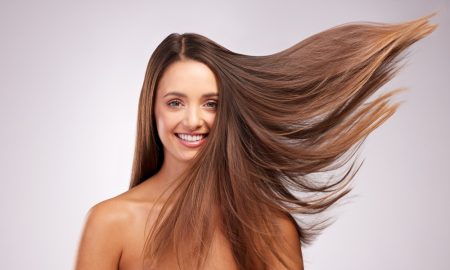 wind and portrait of woman with smile, hairstyle shine and luxury salon treatment