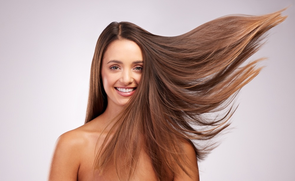 wind and portrait of woman with smile, hairstyle shine and luxury salon treatment