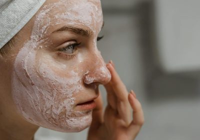 women applying skin cream