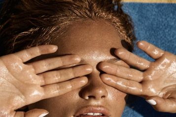 women with hands on face