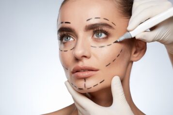 Beautiful girl with puncture lines on face