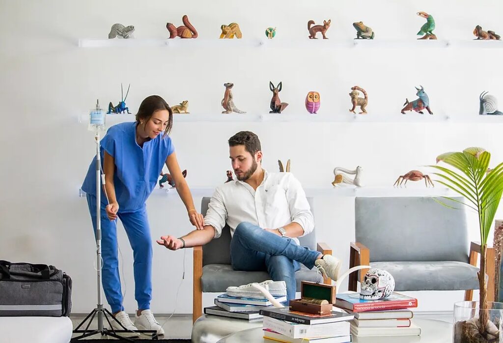 Key Basis IV nurse giving a man mobile IV therapy at home in Miami