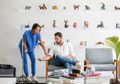 Key Basis IV nurse giving a man mobile IV therapy at home in Miami
