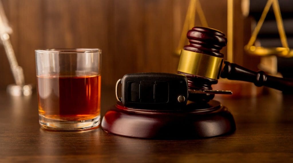 Whiskey With Car Keys And Handcuffs Concept For Drinking