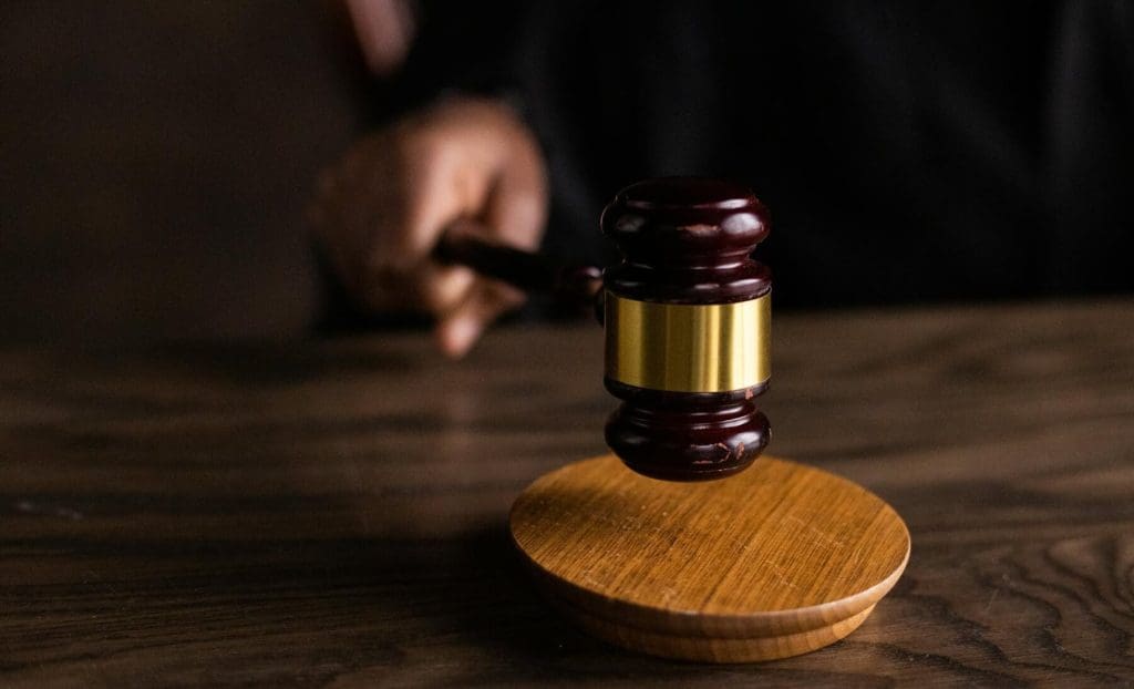 brown wooden gavel on brown wooden table