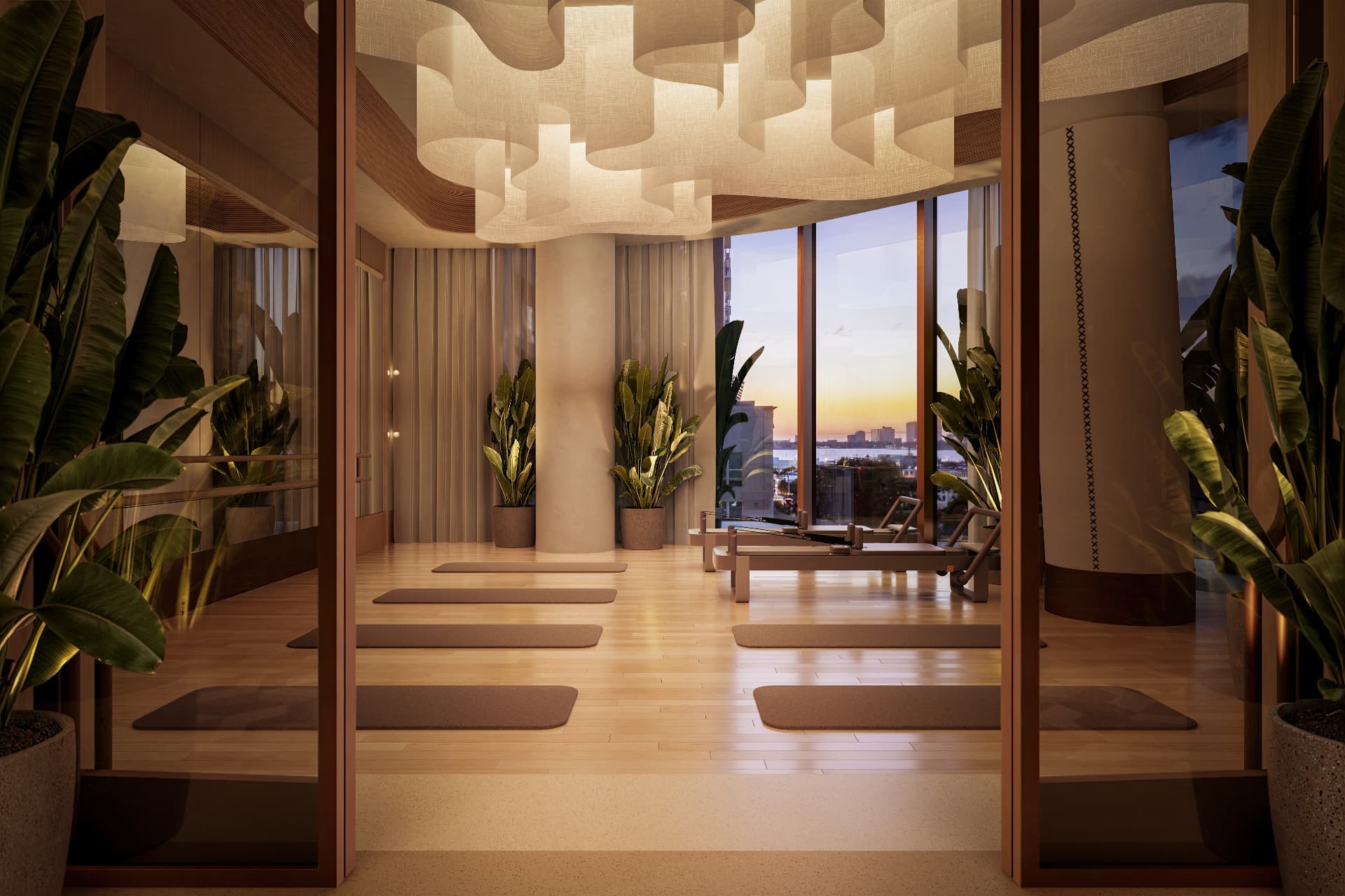 Yoga and Pilates studio at Waldorf Astoria Residences Sarasota overlooking Sarasota Bay at sunset