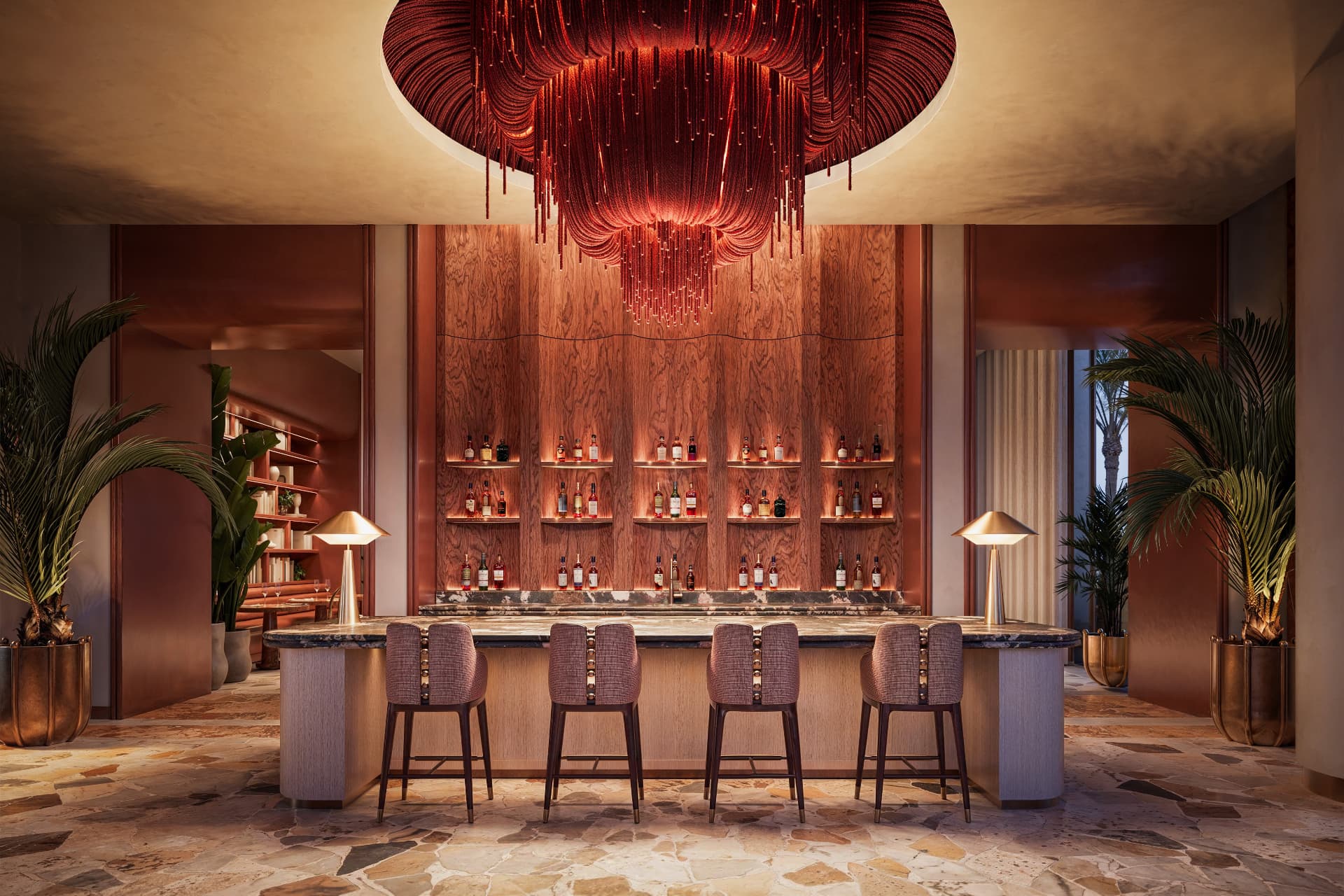 Peacock Alley Bar at Waldorf Astoria Residences Sarasota beneath a red fiber-optic chandelier