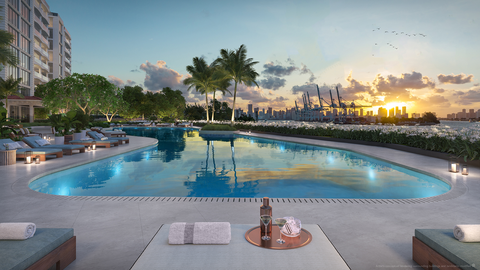 Bayfront pool deck at sunset with Miami skyline exposure