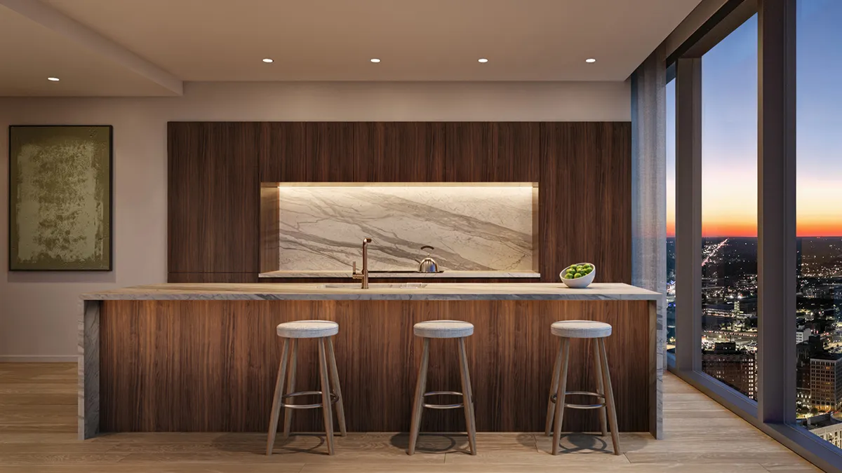 Detroit Edition kitchen with rich wood cabinetry and marble countertops