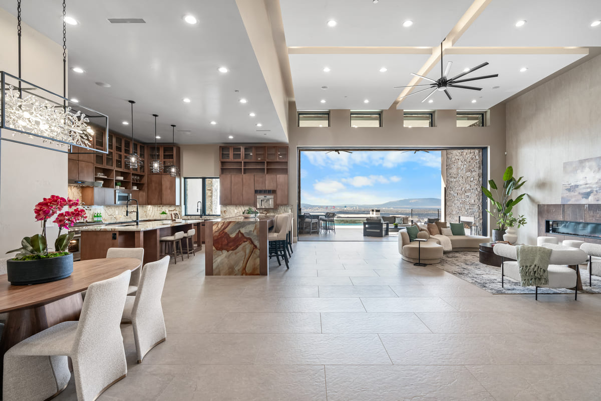 Open-concept living area with kitchen island and mountain views