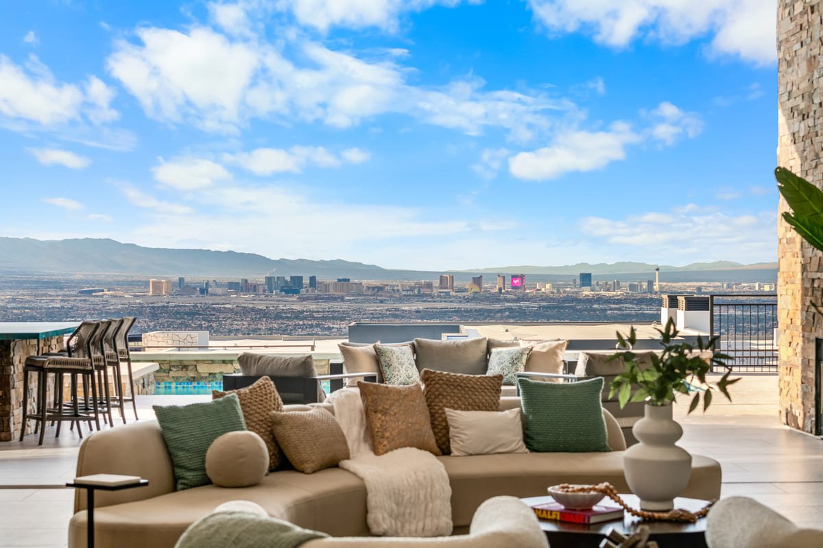 Outdoor patio lounge with panoramic Las Vegas Strip and mountain views