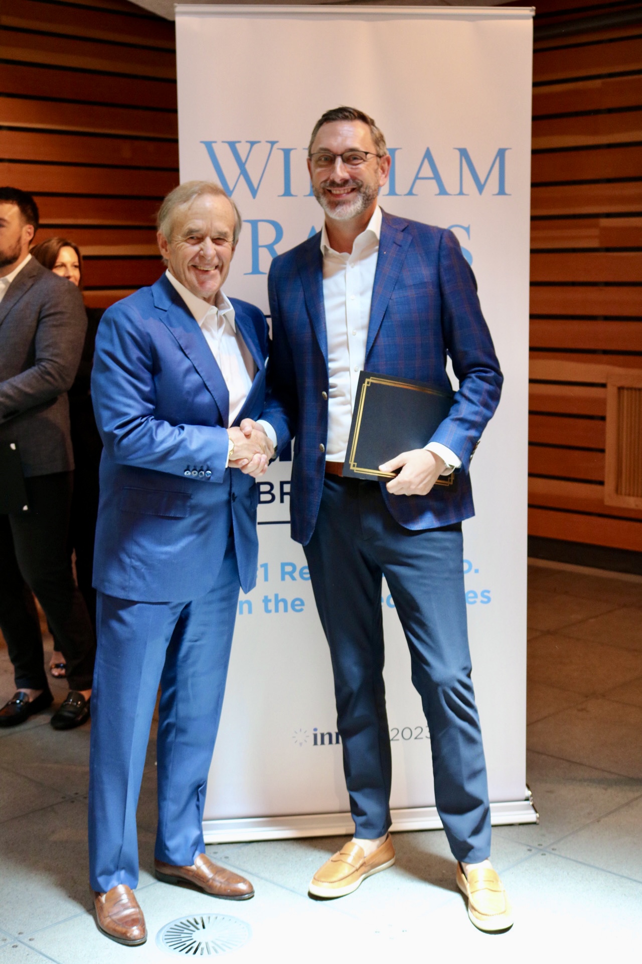 Matt Brown receiving recognition from William Raveis leadership