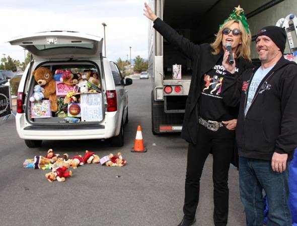 Susan Anton of Menopause the Musical with van at KLUC Toy Drive