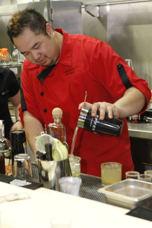 Mixologist pouring drinks