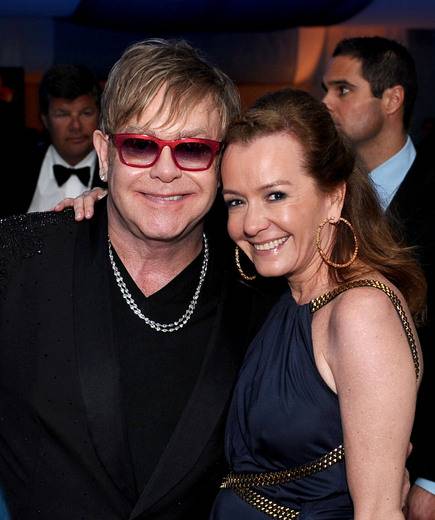 Sir Elton John and Caroline Scheufele, Chopard Co-President & Creative Director at the EJAF Academy Awards Viewing Party