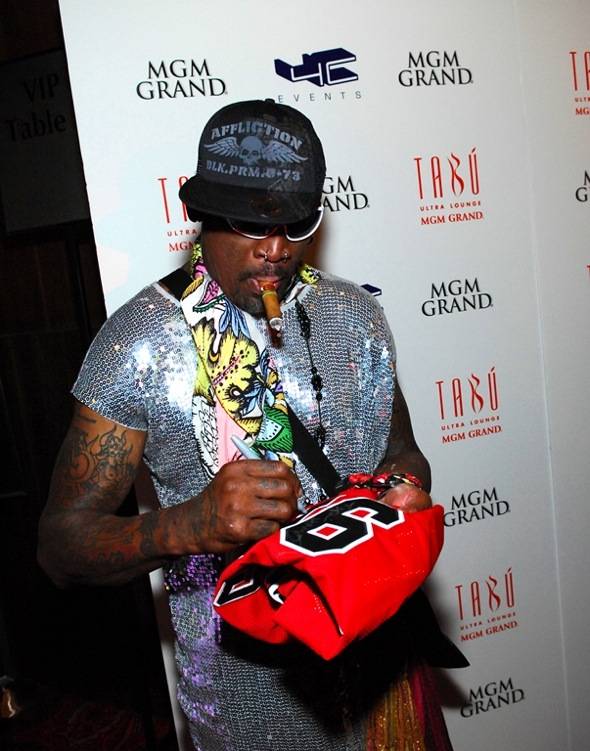 Dennis Rodman signs a jersey on the red carpet at Tabú Ultra Lounge at MGM Grand 3.17.12