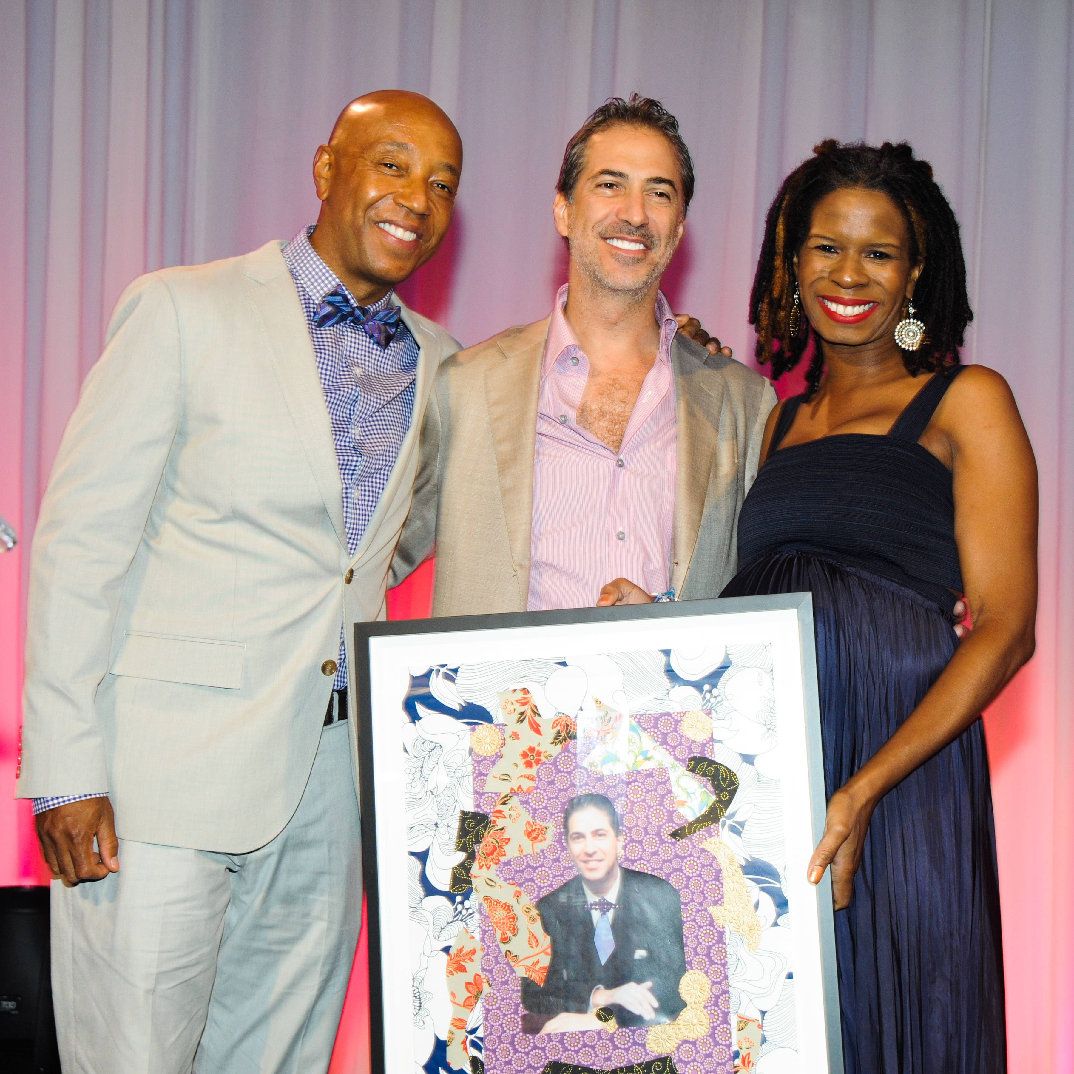 Marc Leder, Tangie Murray, and Russell Simmons Accepting Award