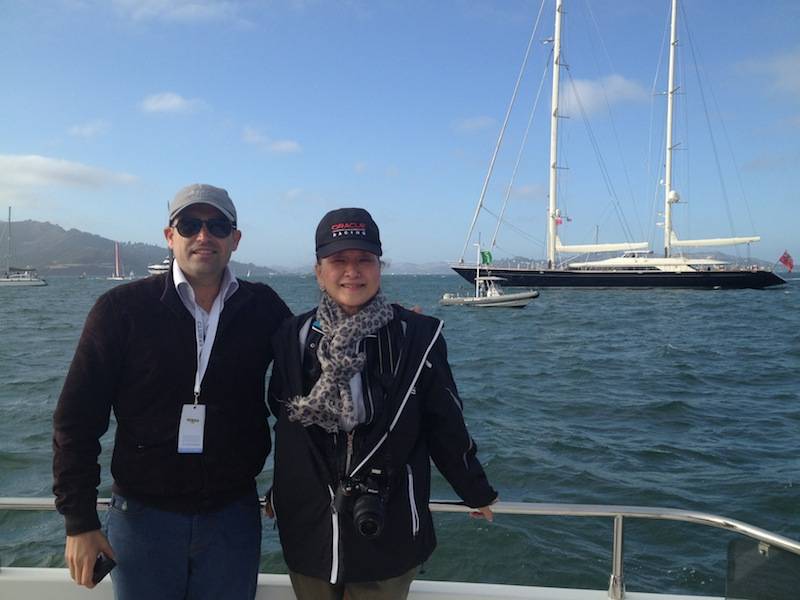 Seth Semilof and Olivia Decker, Larry Ellison’s yacht Asahi in the background