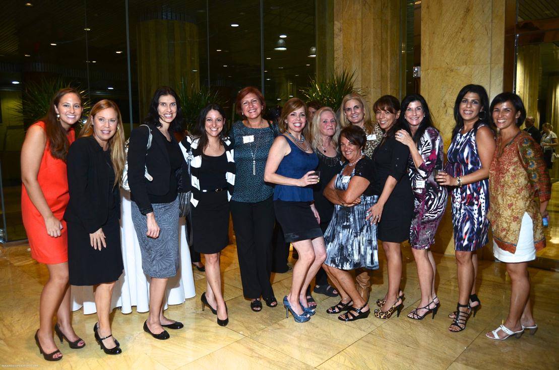 Members pose for a photo during a Switchboard of Miami social event at the Brickell Bay Office Tower on Thursday, Sept. 27, 2012 in Miami Beach, Fla. The non-profit organization Switchboard will present the “All Star” Non-Profit Awards Luncheon, celebrating five non-profits for their achievements at Jungle Island, Watson Island, Fla., on Friday Novermber 9, 2012.