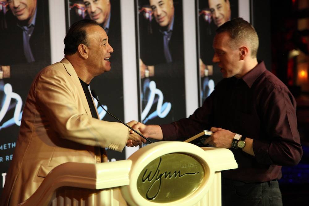 Jon Taffer offering words of wisdom to a fan during the Oct. 11 book signing
