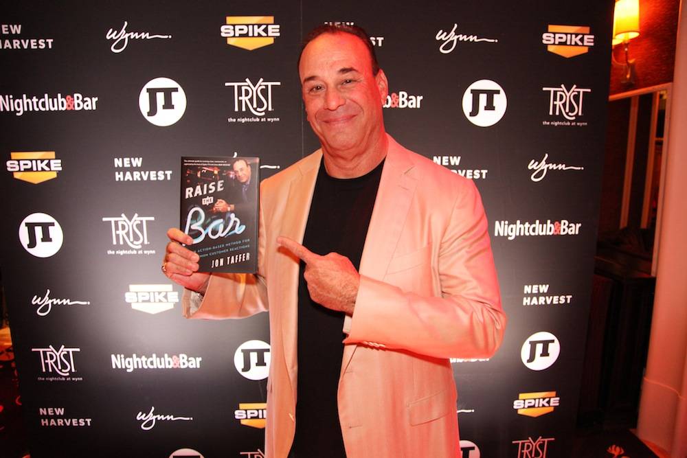 Jon Taffer with his newest book “Raise the Bar – An Action-Based Method for Maximum Customer Reactions”