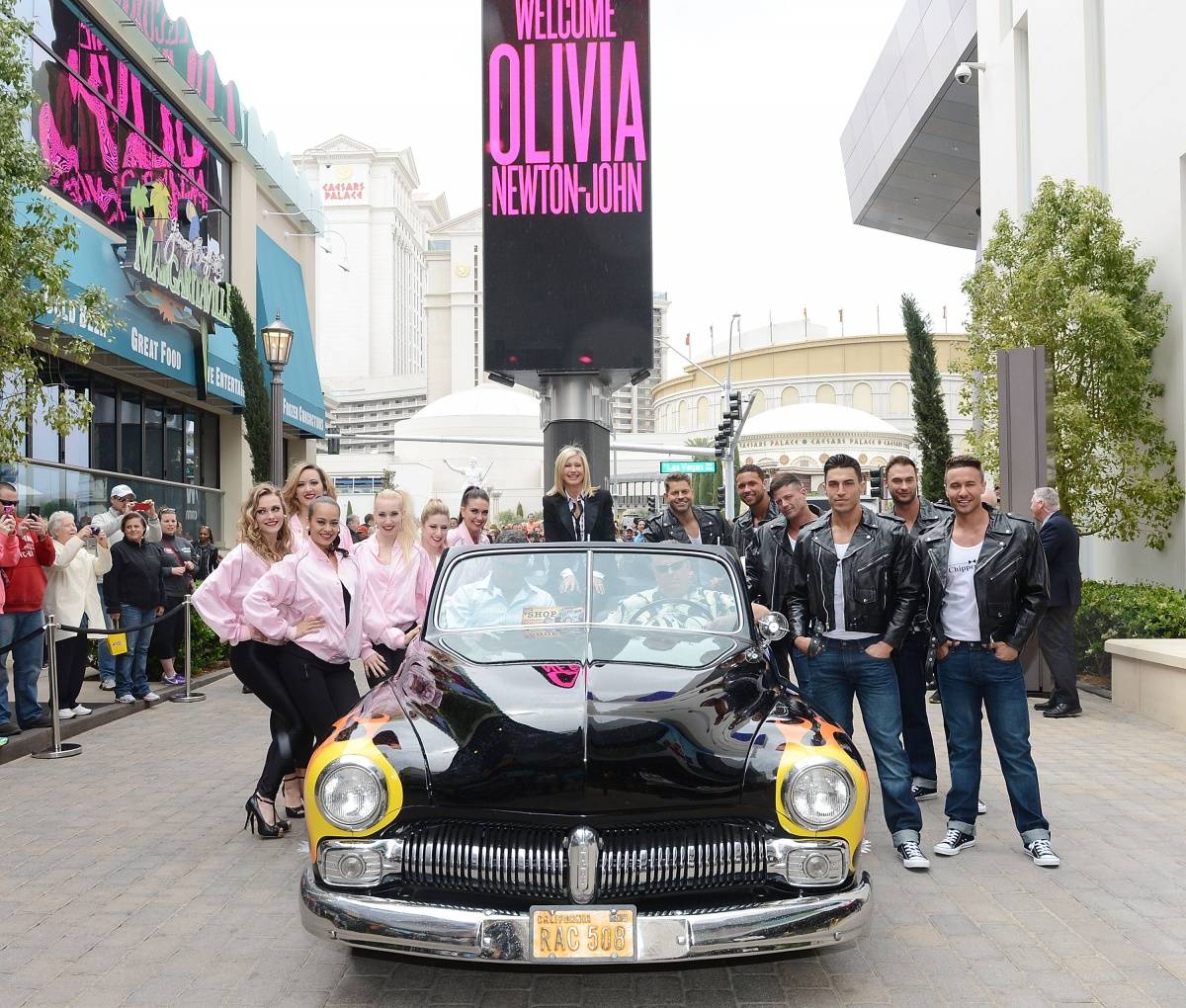 Haute Events: Olivia Newton-John Arrives for Her Flamingo Residency in a  1949 Mercury “Hell's Chariot” from Grease - Haute Living