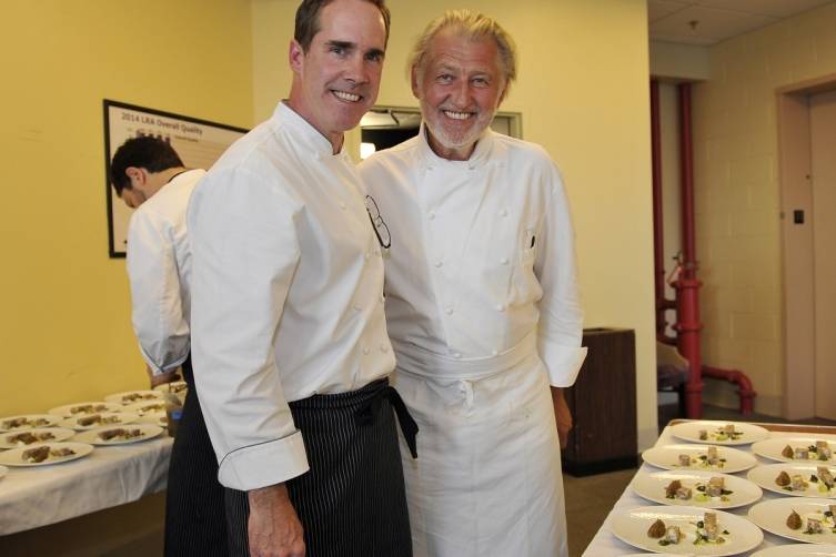 Shawn McClain and Pierre Gagnaire pose before sending out dishes during A Twist on Dinner (credit Isaac Brekken for Bon Appetit)