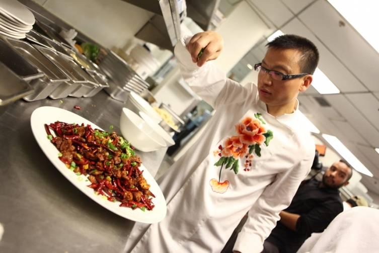 Chef Tony Hu applies finishing touch to famed Three Chili Chicken dish