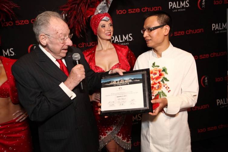 Oscar Goodman presents Chef Tony Hu with certificate of recognition