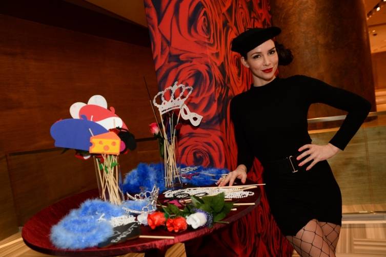 A model poses in the photo booth at BARDOT's grand opening