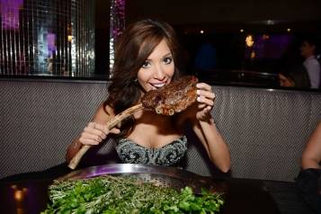 Farrah Abraham Biting into Tomahawk Steak at N9NE Steakhouse