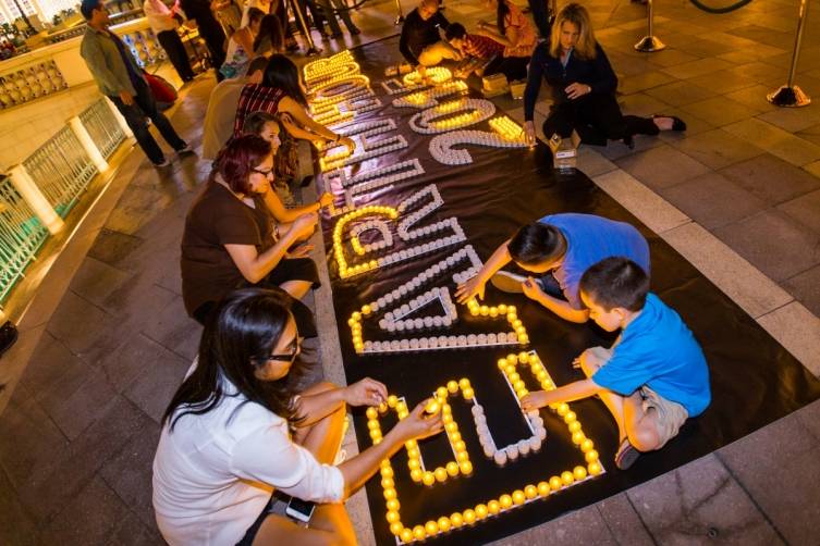 Guests and team members help with the Earth Hour display at The Venetian