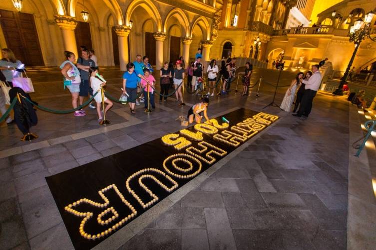 The last candle is put in place for the Earth Hour display at The Venetian