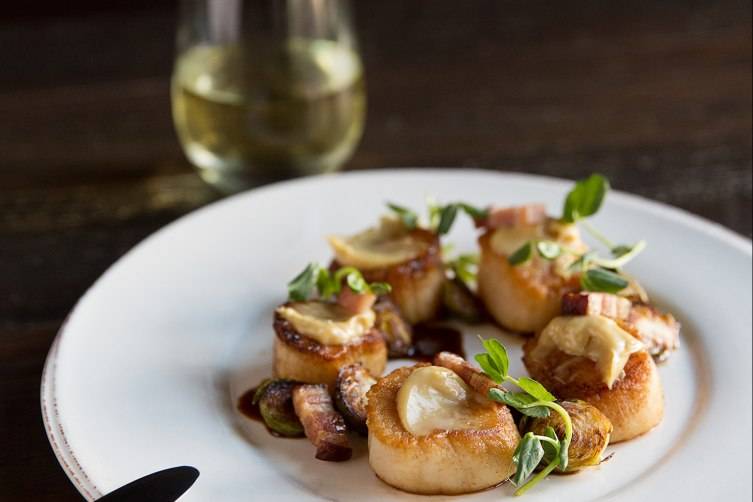 Pan-seared scallops with roasted brussel sprouts and bacon lardons