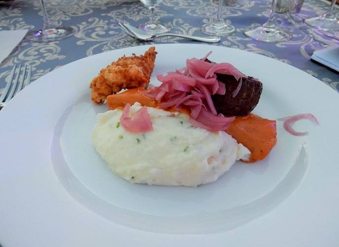 Barbecued spiced beef filet and chicken fried Maine lobster with loaded whipped potatoes