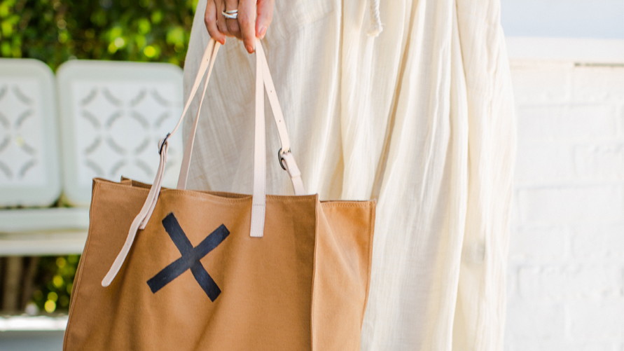 The Charitable Story Behind The Bag All Of Hollywood Is Buzzing About This Holiday Season