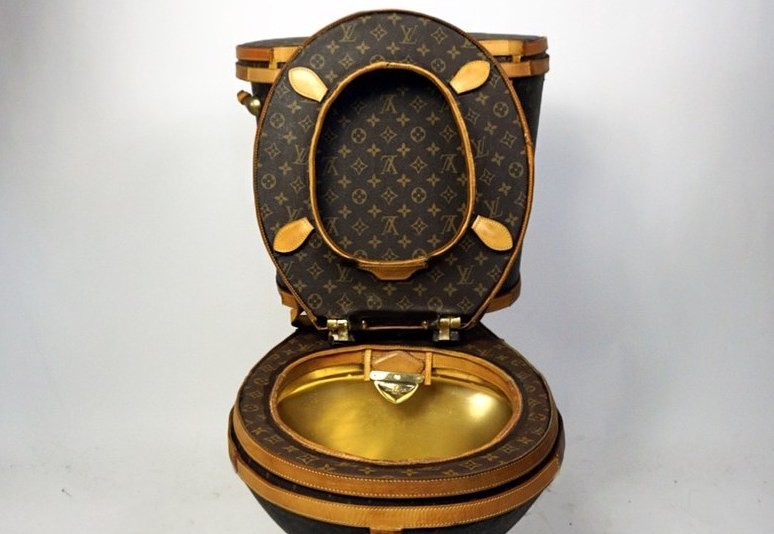 Yes, this is real - A golden toilet covered in Louis Vuitton bags