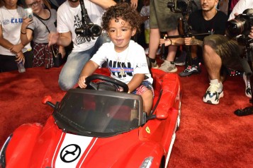 Asahd Khaled in toy Ferrari from Cybex