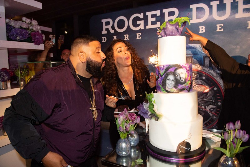 DJ Khaled and Nicole Tuck blowing out the birthday cake