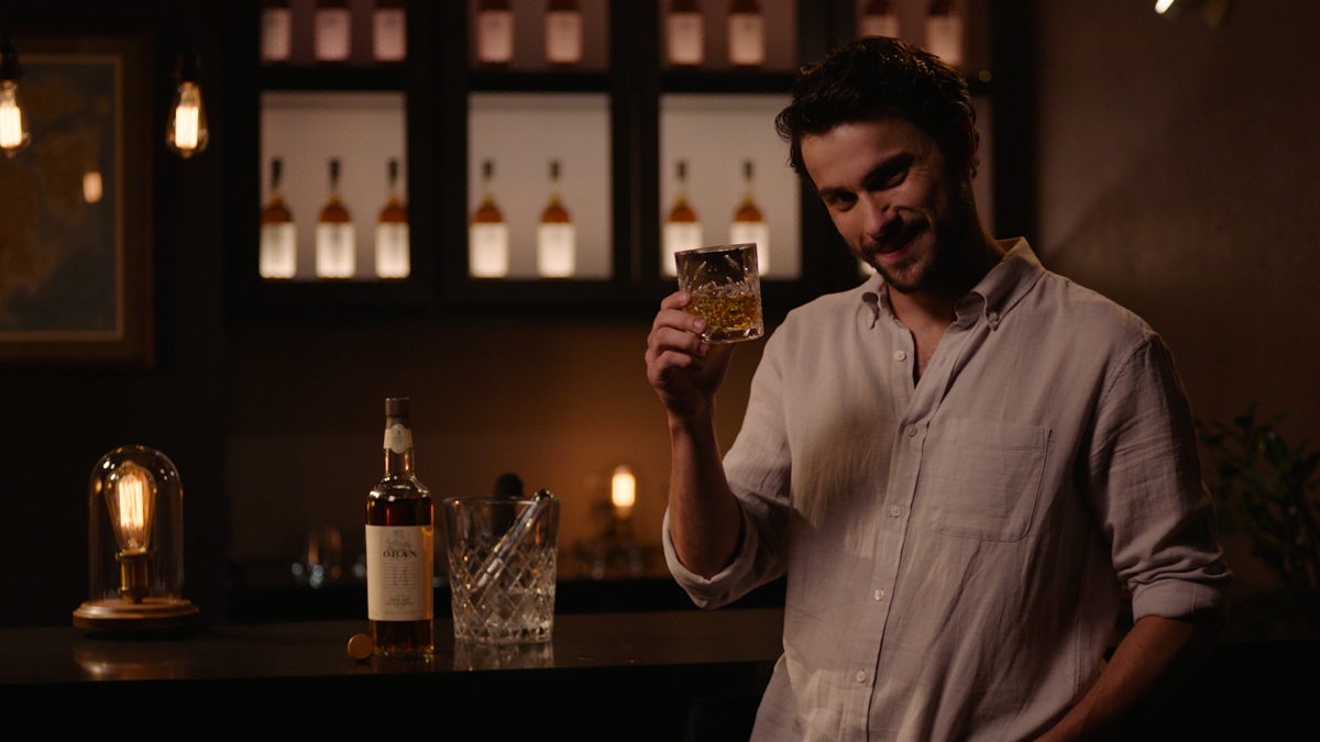 Jack Falahee Dishes On The Art Of Drinking Scotch + What He Loves About Working With “Murder” Boss...