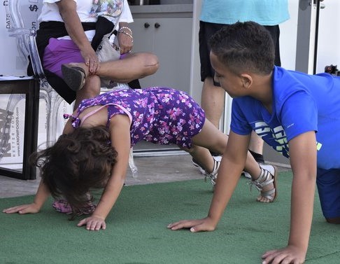 Children Participaing In Hour Push-Up Challenge